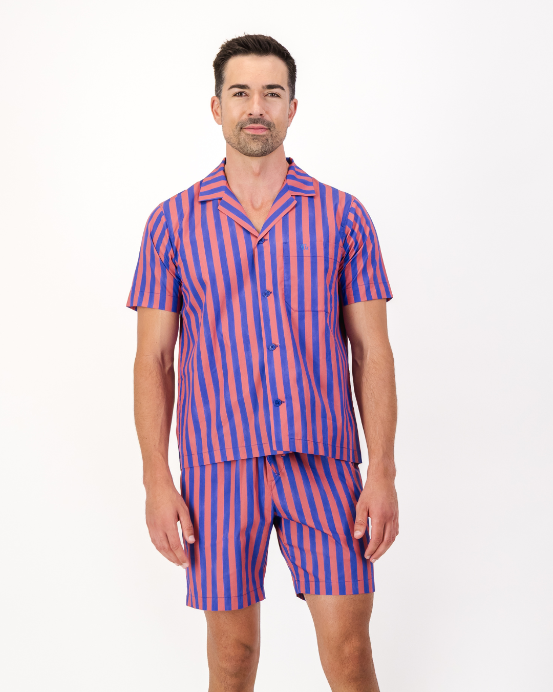 Man wearing a red and blue striped organic pyjama set