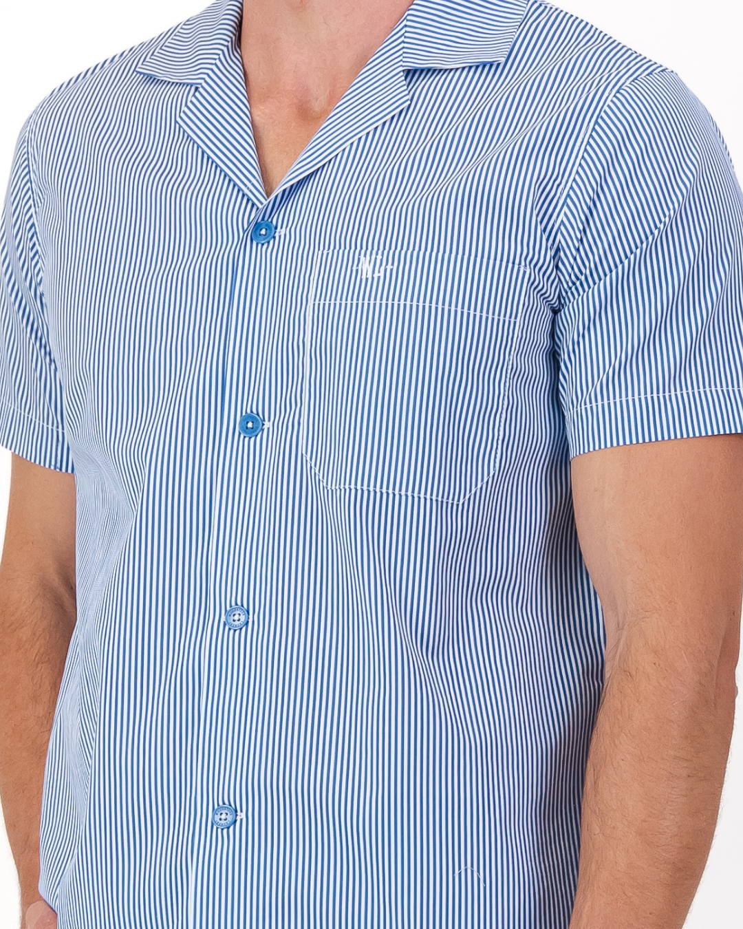 Signature Woodstock Laundry embroidery on the chest pocket of a men’s blue and white striped organic cotton pyjama shirt