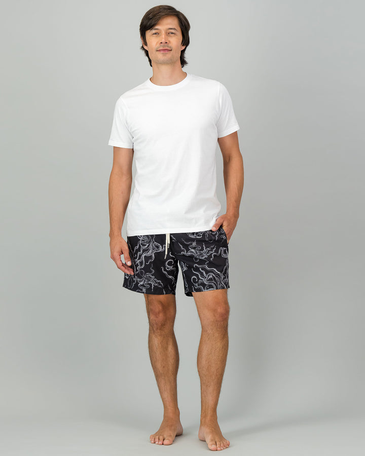 Mens Swim Shorts - White Octopus on Black Full Body Front - Woodstock Laundry
