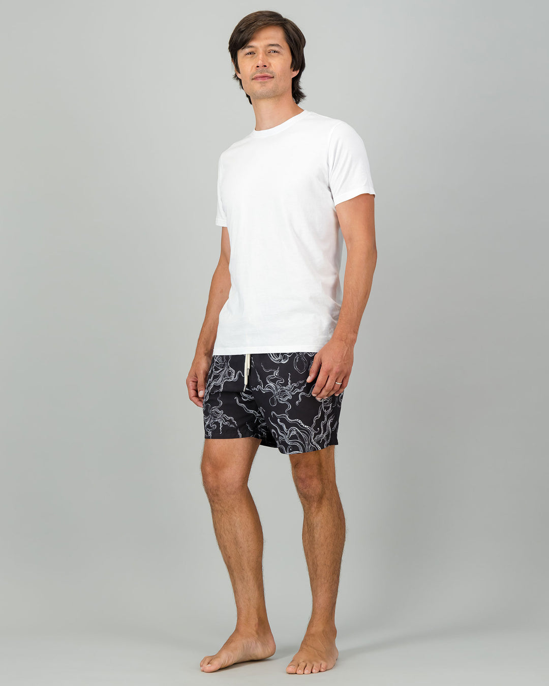 Mens Swim Shorts - White Octopus on Black Full Body Side - Woodstock Laundry
