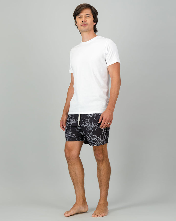 Mens Swim Shorts - White Octopus on Black Full Body Side - Woodstock Laundry