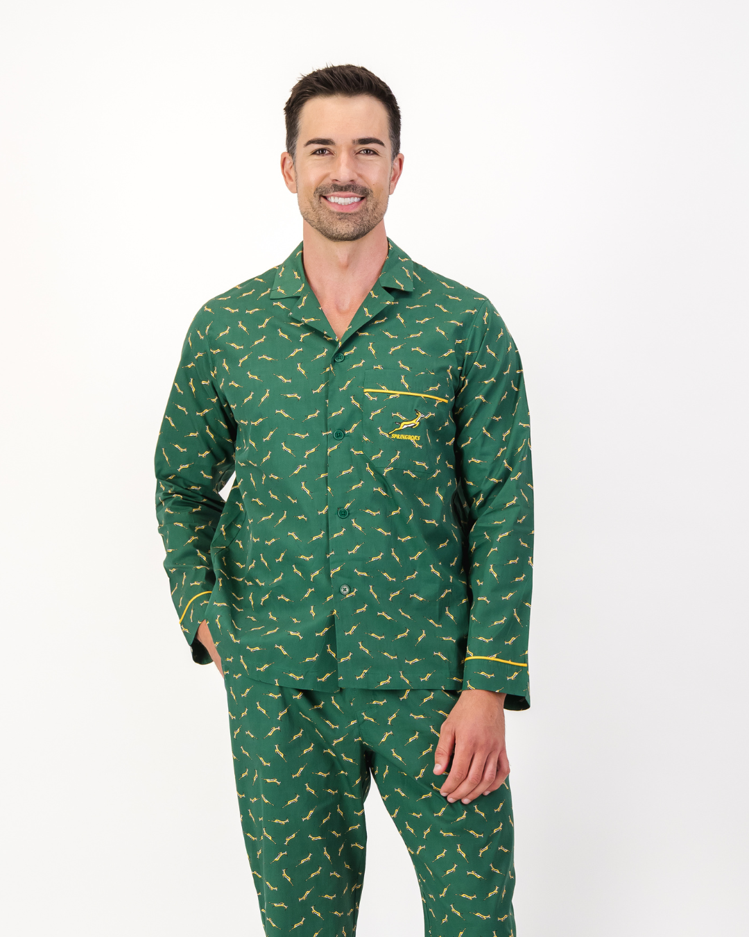 Man wearing official Springboks organic cotton long pyjama shirt with yellow piping