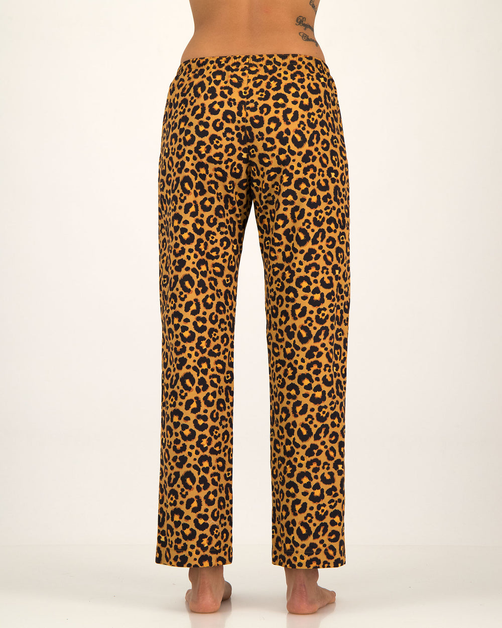 Leopard print lounge pants on a white background